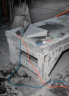Granite Block and angle grinder on top a heavy duty table