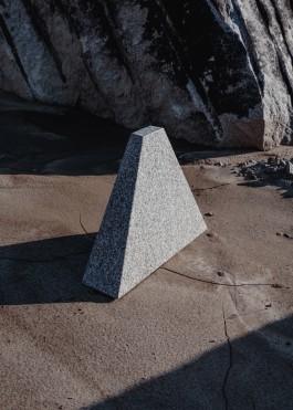 a granite trapezoid illuminated by sunrays