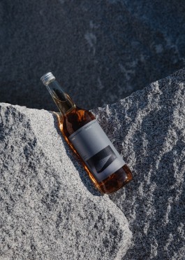a bottle of fernet propped up against granite
